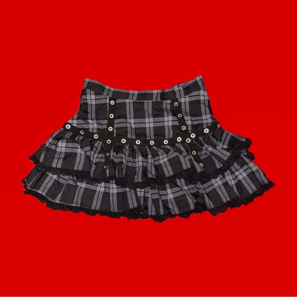 Black and grey plaid mini skirt with lace trim, studded lining, and back bow - Picture 2 of 3